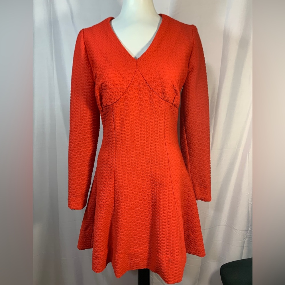 60s Skater Mod Dress
Polyester knit size 4/6.
Bright Orange red empire waist